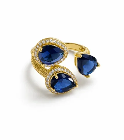 Anillo Zafira dorado con cristales azul profundo diseño elegante