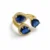Anillo Zafira dorado con cristales azul profundo diseño elegante