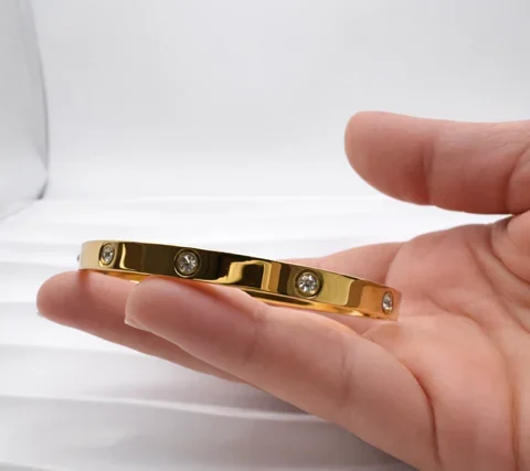 Pulsera rígida Stella de acero inoxidable dorado con circonitas