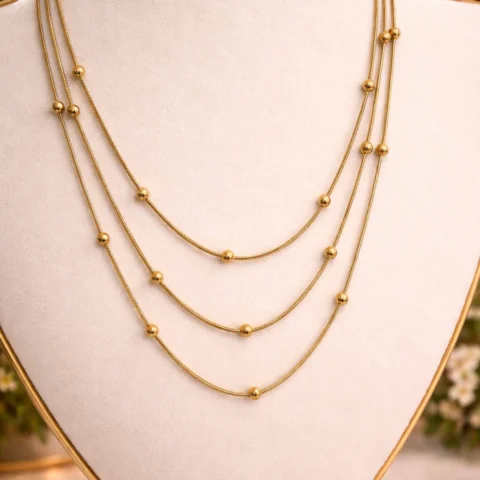 collar brisa dorado acero inoxidable multicadena en expositor