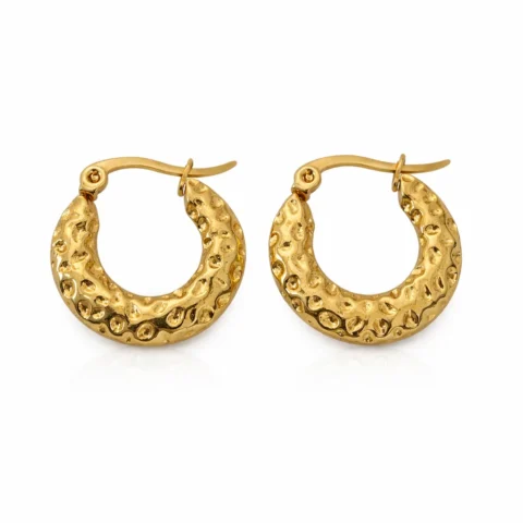 aros terra dorados textura irregular acero inoxidable fondo blanco