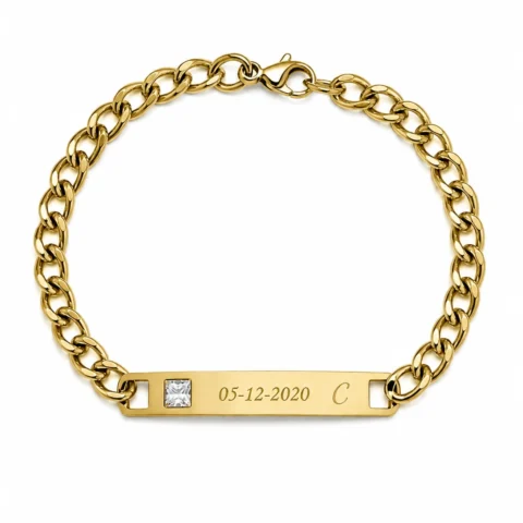 Pulsera personalizada dorada Élya con placa grabada y detalle de circonita sobre fondo blanco