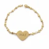 pulsera corazón grabable dorada Nexo Amor en acero inoxidable fondo blanco