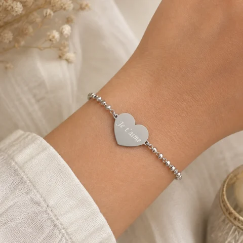 pulsera corazón grabable plateada Nexo Amor en acero inoxidable fondo blanco