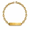 Pulsera dorada con placa grabable Nexo Unión sobre fondo blanco con acabado brillante